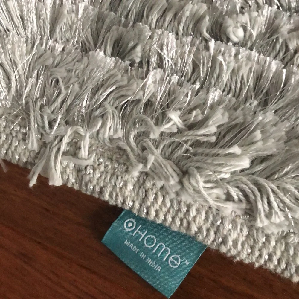 Last chance. Light grey/silver bath rug 1 of 2